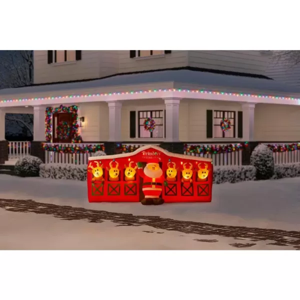 Home Accents Holiday 9 ft Giant-Sized LED Inflatable Santa's Stable with Reindeer